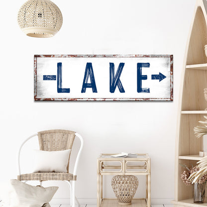 Rustic Lake Arrow Sign canvas with bold blue distressed letters and a rusted frame on Tampa Home & Garden Store