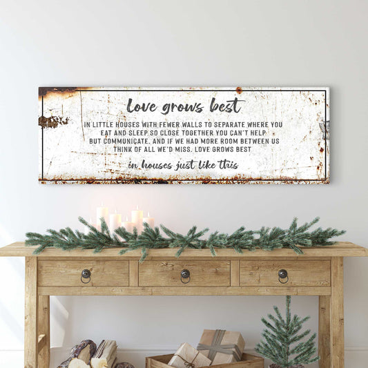 Love Grows Best canvas sign by Tailored Canvases, distressed white with black text on Tampa Home & Garden Store