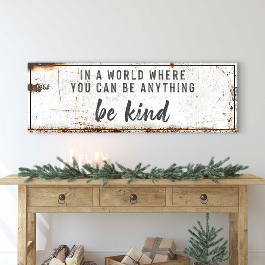 In A World Where You Can Be Anything Be Kind canvas sign with distressed white surface on Tampa Home & Garden Store