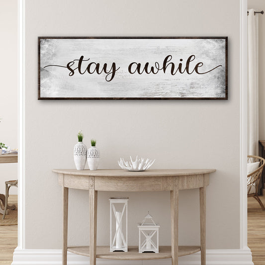 Stay Awhile Sign III canvas wall art, distressed white background with dark wood frame on Tampa Home & Garden Store