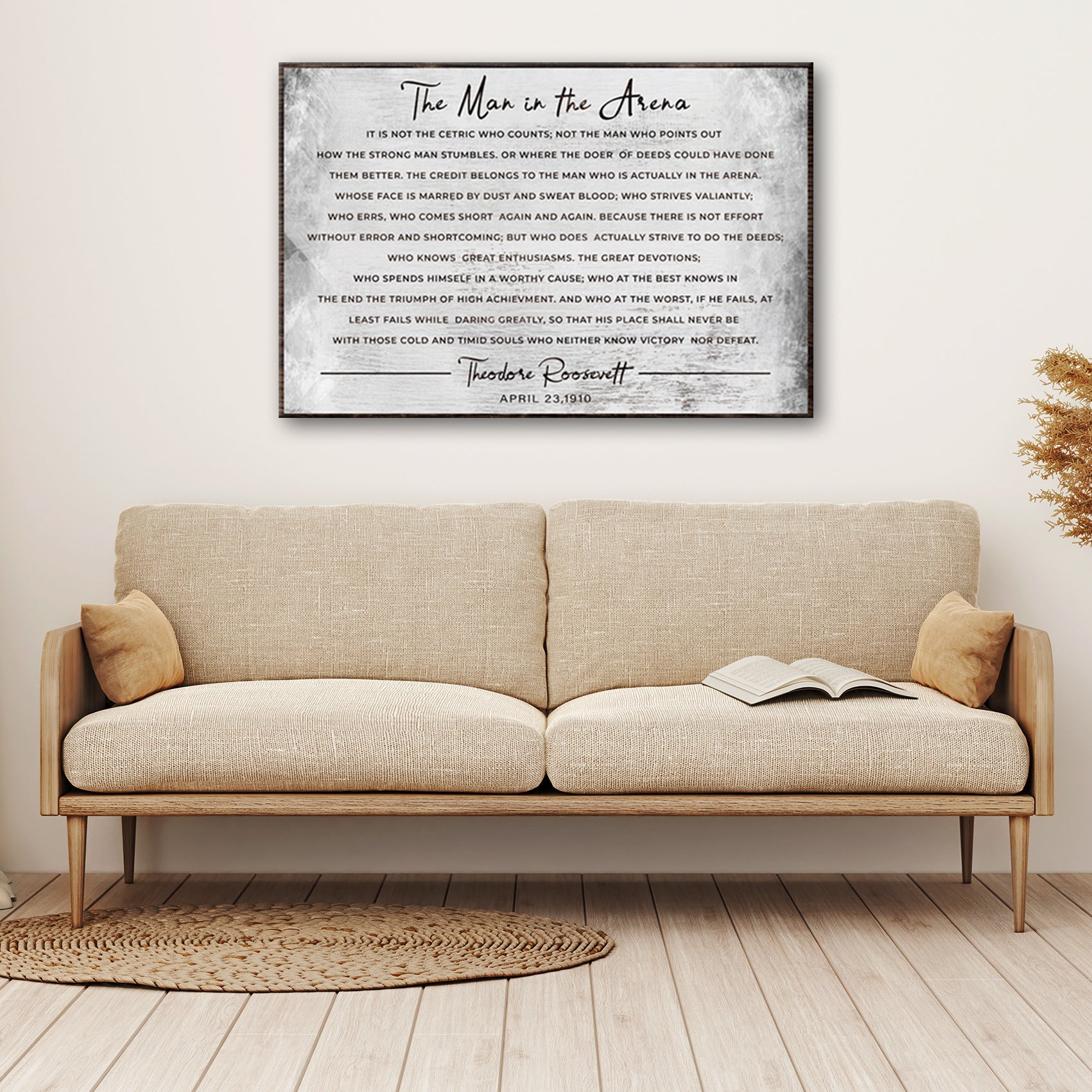 The Man In The Arena Grunge Sign canvas wall art in grayscale with a dark frame on Tampa Home & Garden Store
