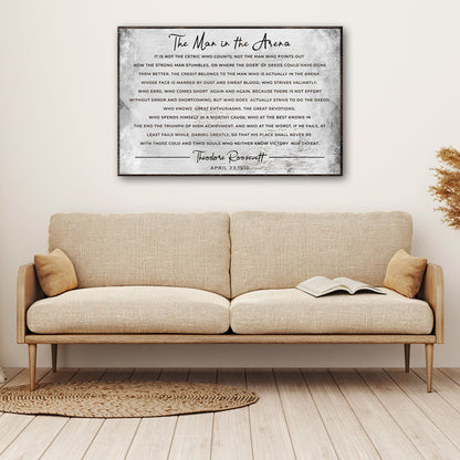 The Man In The Arena Grunge Sign canvas wall art in grayscale with a dark frame on Tampa Home & Garden Store