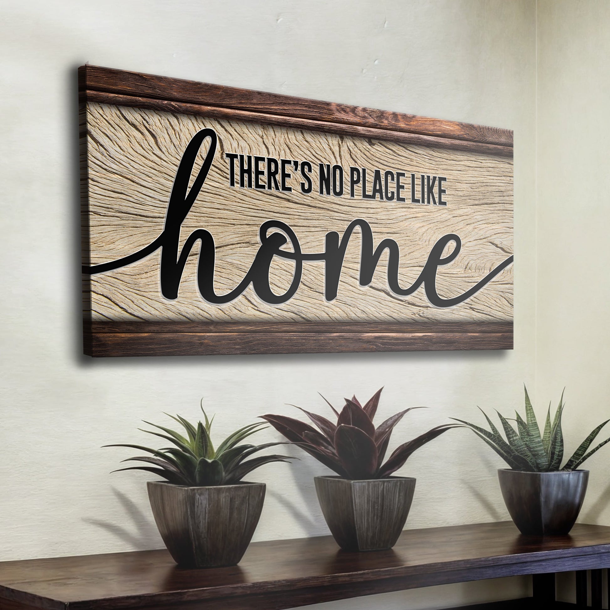 No Place Like Home canvas sign with rustic wood grain background and dark brown frame on Tampa Home & Garden Store