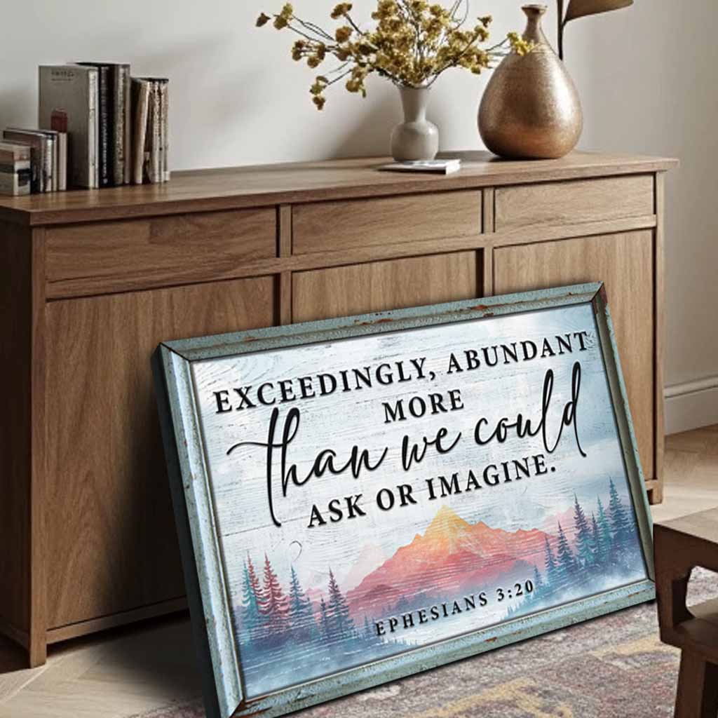 Ephesians 3:20 canvas sign in blue distressed frame with mountain scene leaning on cabinet on Tampa Home & Garden Store