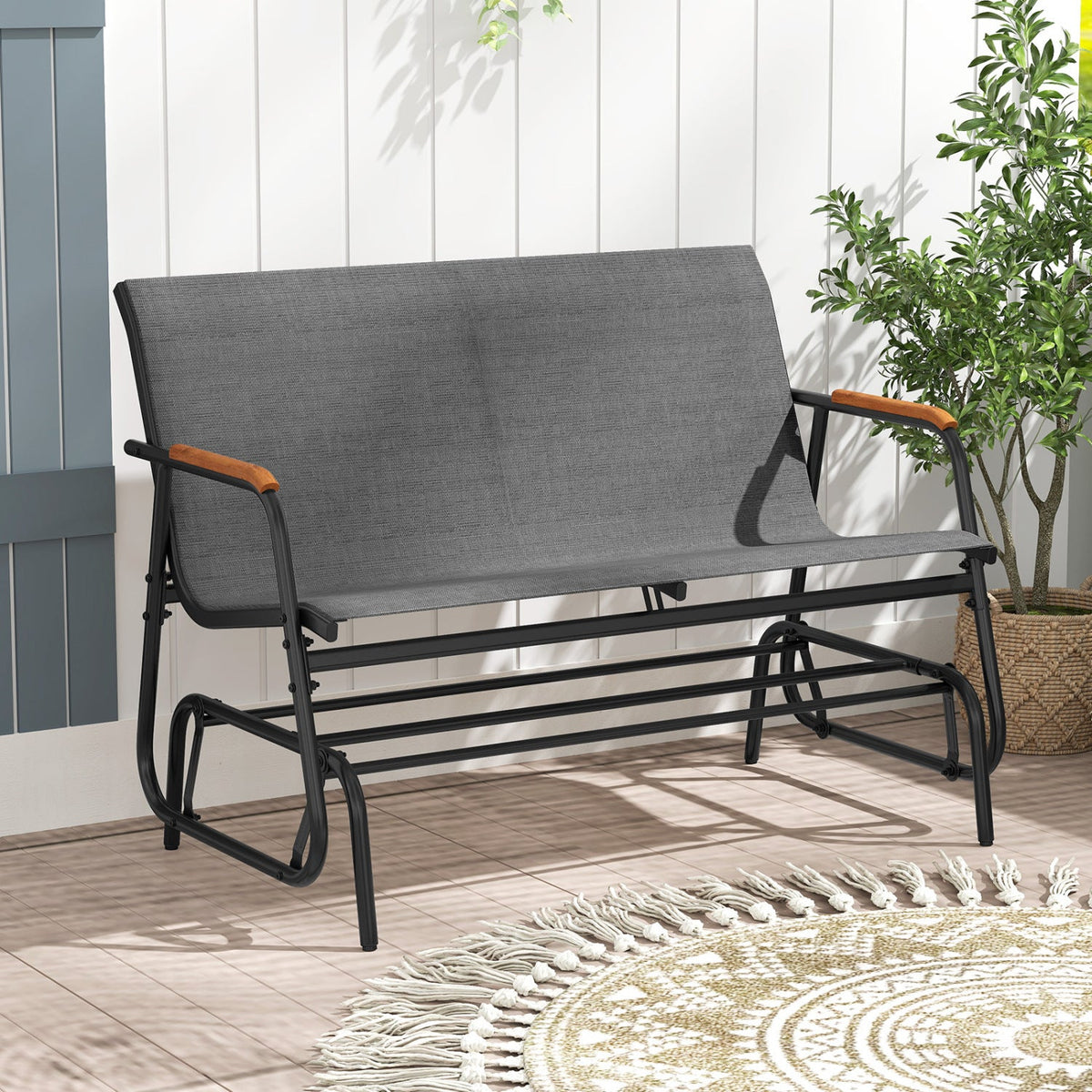 Patio glider bench with teak armrests, breathable gray fabric on black metal frame DirectDeals on Tampa Home & Garden Store