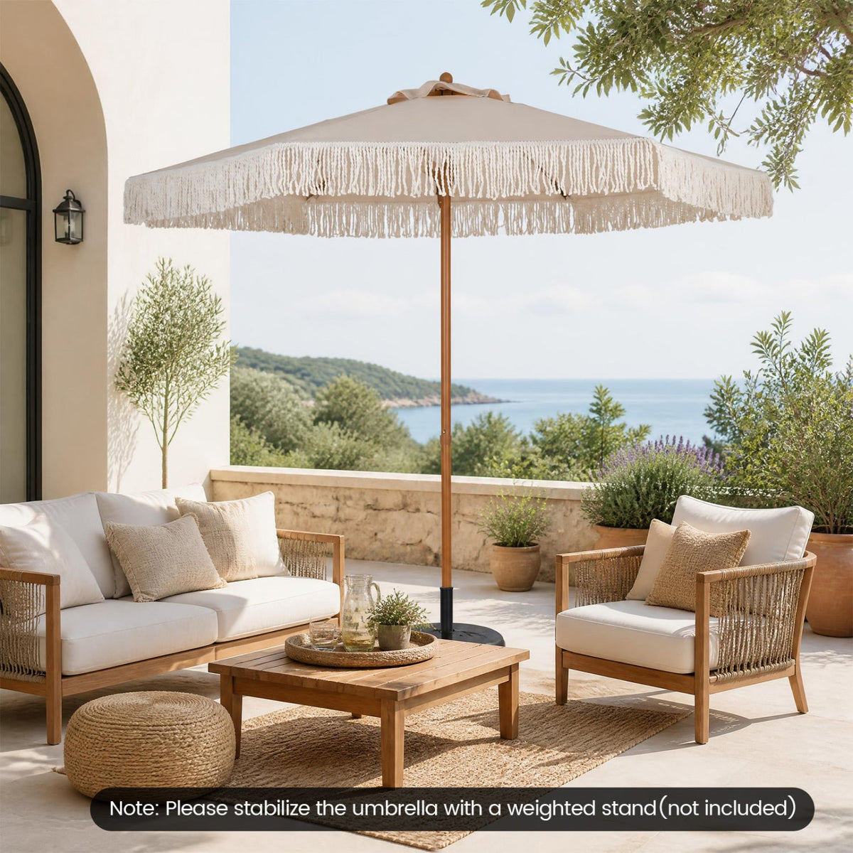 Boho Fringe Patio Umbrella DirectDeals beige canvas on wooden pole over white seating on Tampa Home & Garden Store