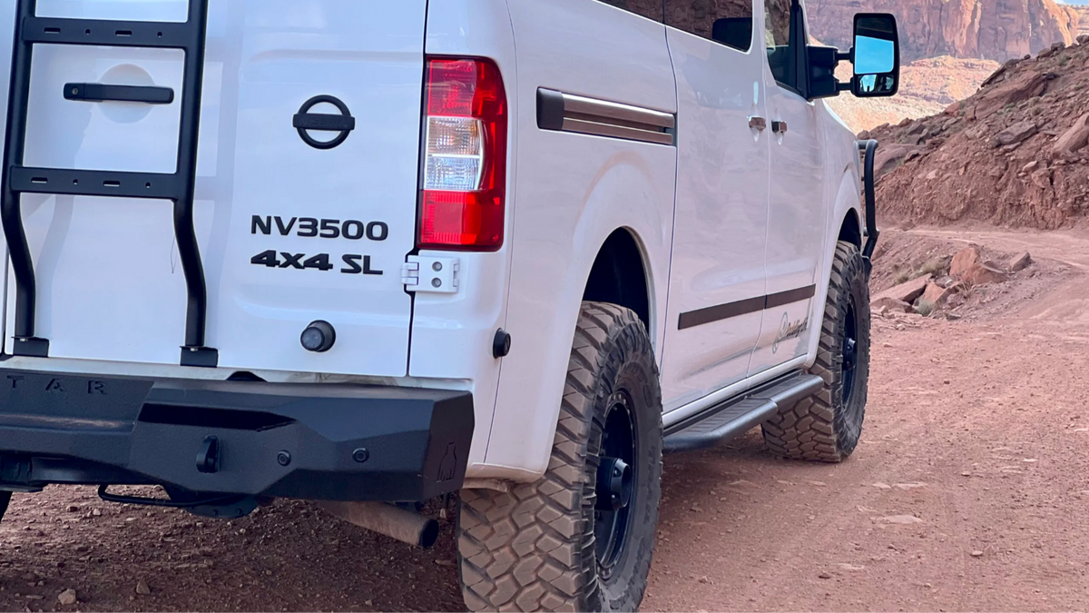 Avatar NV3500 RockBody side steps in black, mounted on a white NV3500 4x4 SL van on Tampa Home & Garden Store