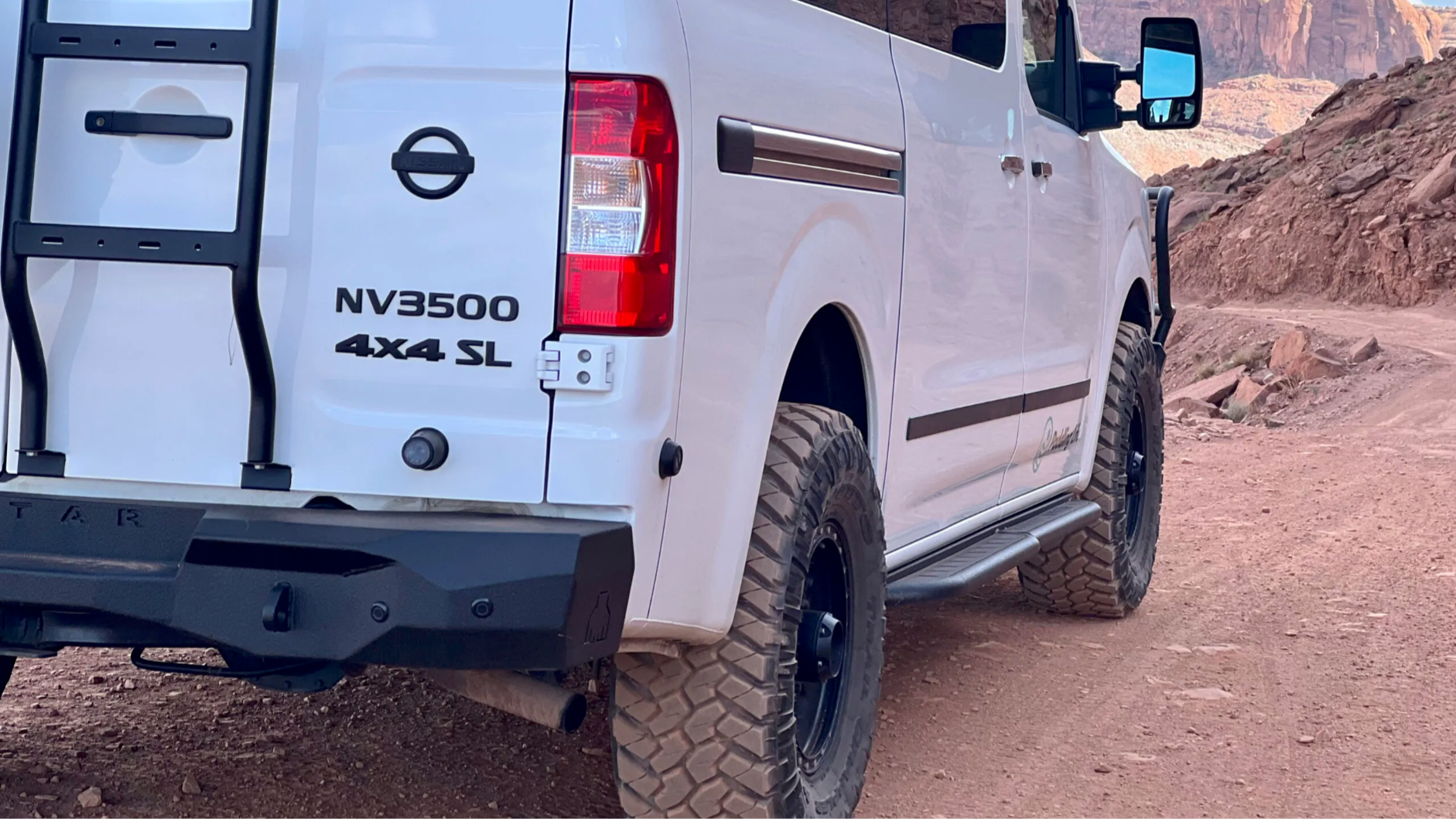 Avatar NV3500 RockBody side steps in black, mounted on a white NV3500 4x4 SL van on Tampa Home & Garden Store