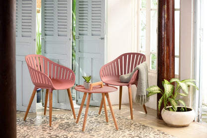 Nassau Carver Armchairs in peony pink, 2pc with wooden legs around a table; throw and plant on Tampa Home & Garden Store