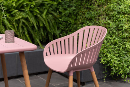 Nassau Bistro Set Peony Pink Social Plastic 3pc with slatted-back chair on wood legs on Tampa Home & Garden Store