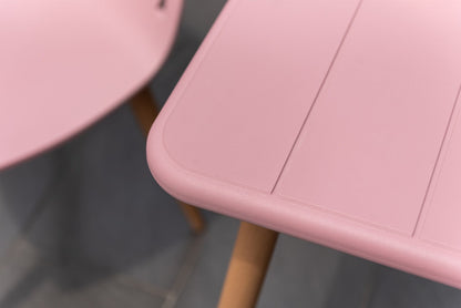Nassau Bistro Set Peony Pink Social Plastic 3pc pink table with rounded edge and wood legs on Tampa Home & Garden Store