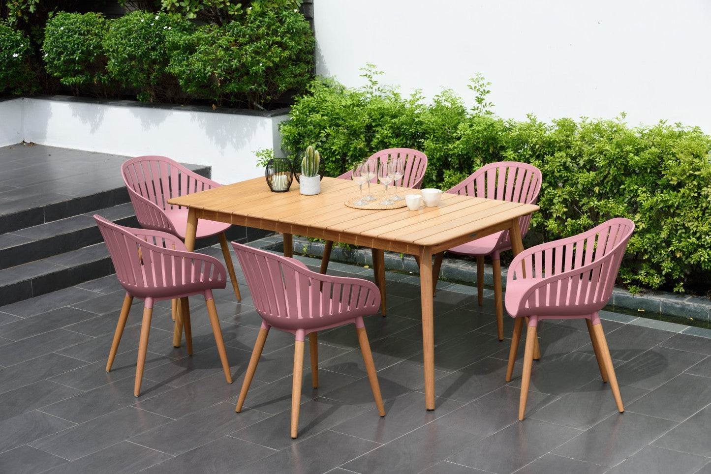 Nassau Rectangular Hardwood Table with six pink outdoor dining chairs on Tampa Home & Garden Store