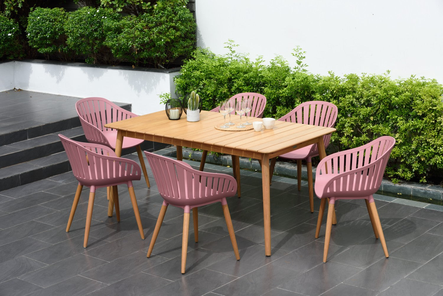 Nassau Rectangular Hardwood Table with six pink outdoor dining chairs on Tampa Home & Garden Store