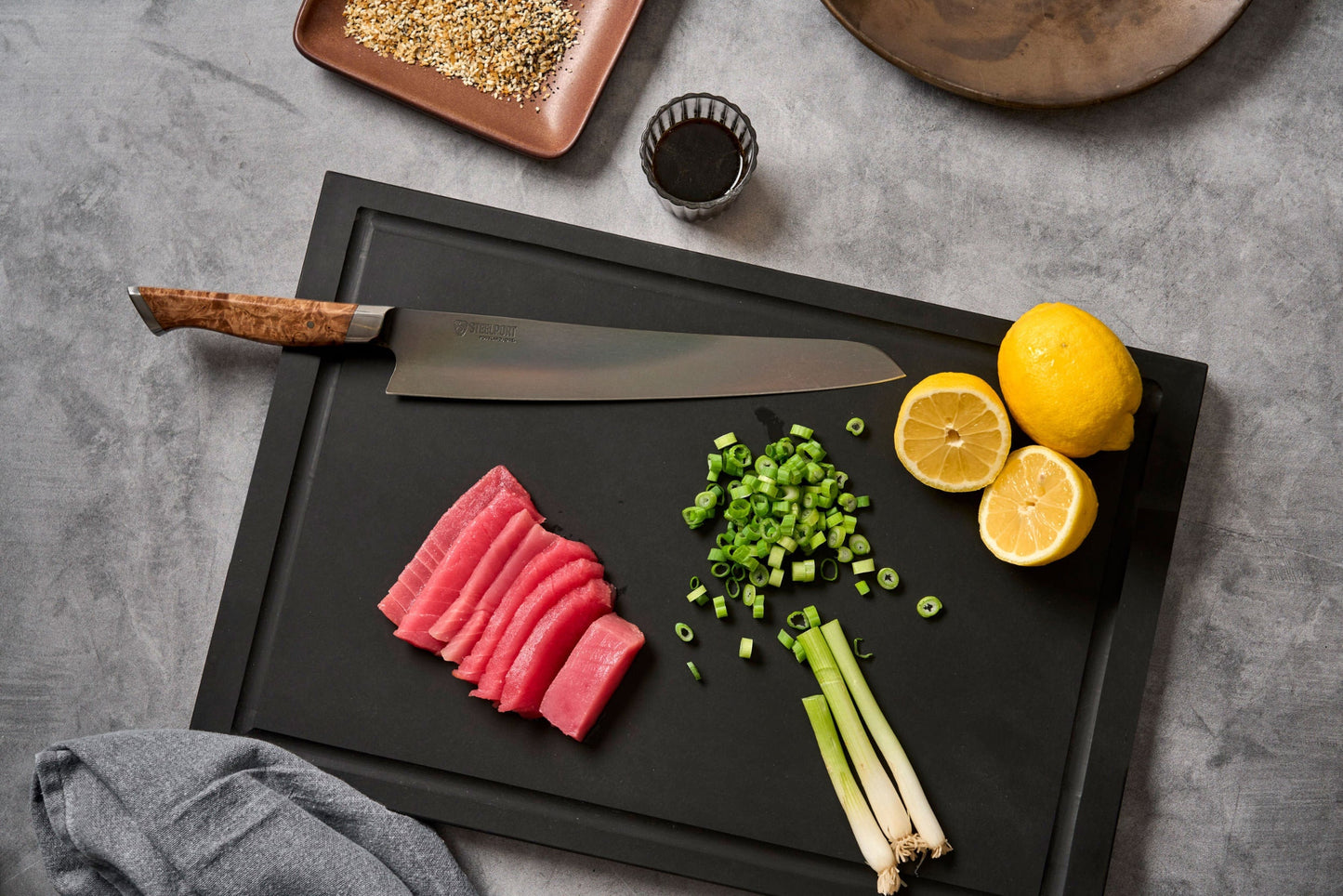 SteelCore 2-in-1 Walnut Cutting Board by STEELPORT Knife Co., knife on black surface on Tampa Home & Garden Store