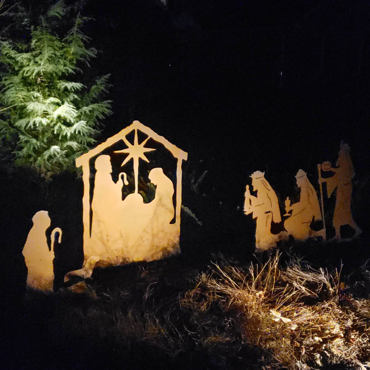 Nativity Scene Outdoor metal silhouette set lit in warm amber; Rustica Ornamentals decor on Tampa Home & Garden Store