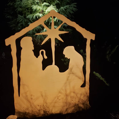 Nativity Scene Outdoor metal silhouette lit with warm amber glow and star above the stable on Tampa Home & Garden Store