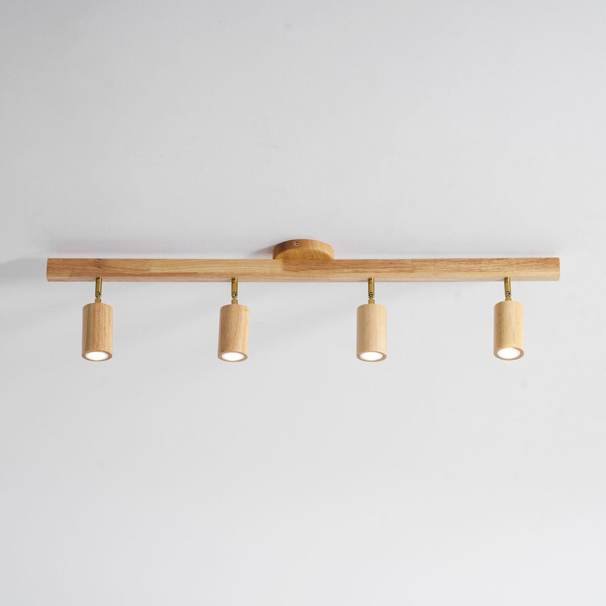Grain wood shade track lighting fixture with four adjustable pendants and brass hardware on Tampa Home & Garden Store