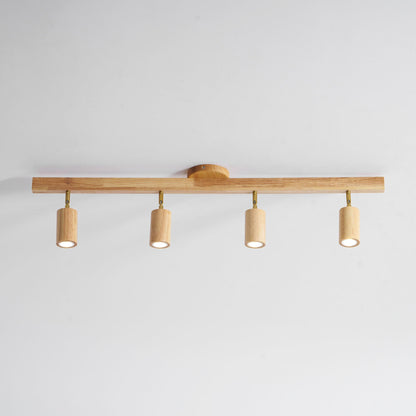 Grain wood shade track lighting fixture with four adjustable pendants and brass hardware on Tampa Home & Garden Store