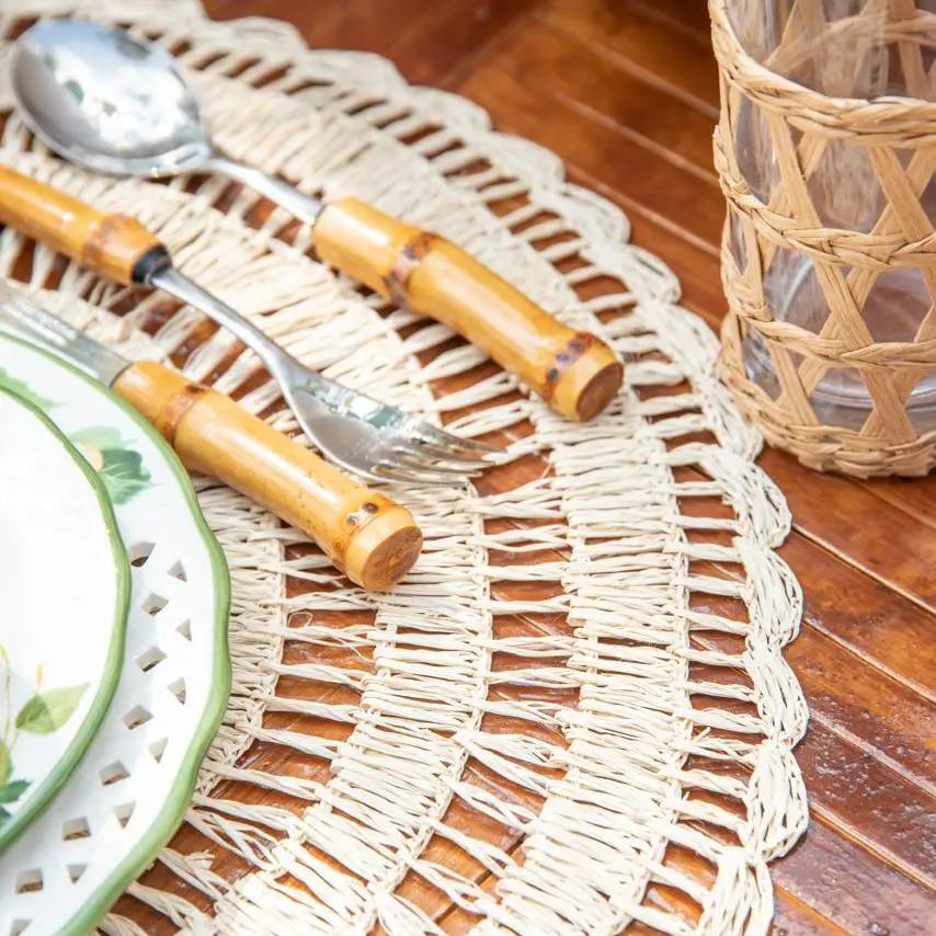 Buriti straw placemat handcrafted by Talah Home; natural woven beige placemat on wood table on Tampa Home & Garden Store