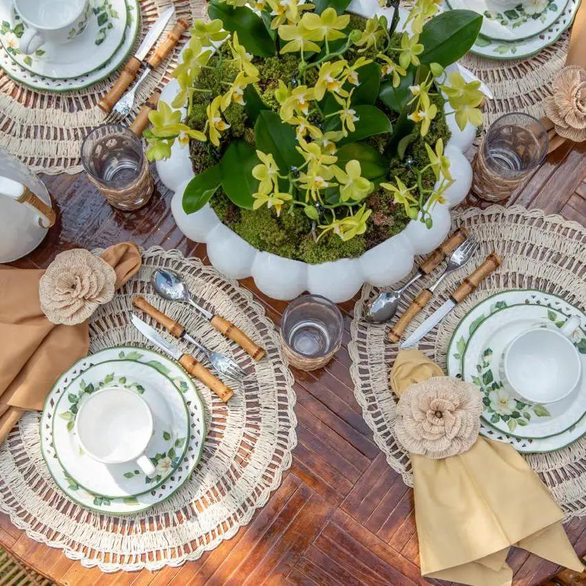 Buriti straw placemats handcrafted by Talah Home natural beige weave under plates on table on Tampa Home & Garden Store
