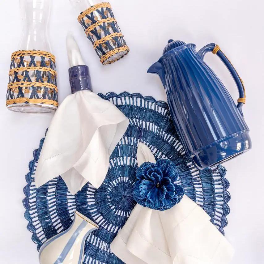 Buriti Straw Placemats by Talah Home, circular cobalt blue woven placemat on Tampa Home & Garden Store
