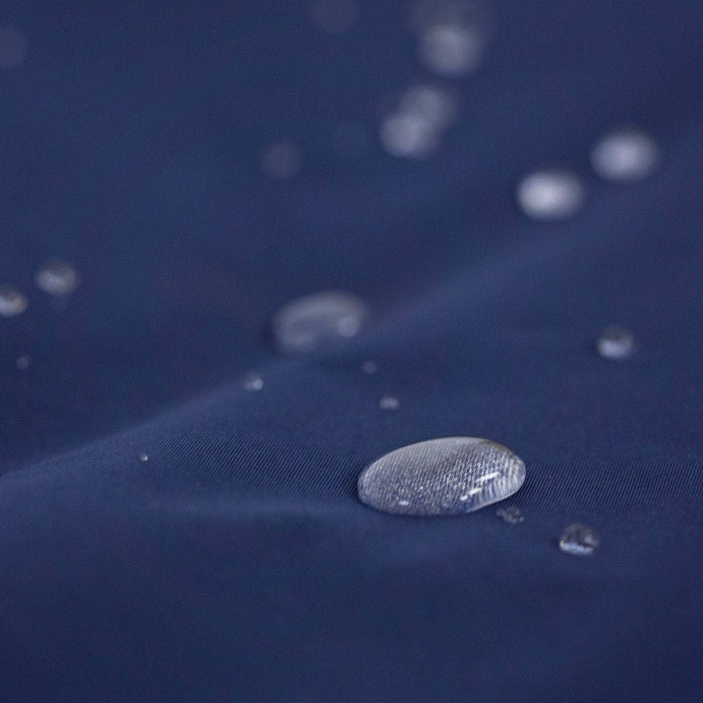 Villanova Large Outdoor Blanket by Pretty Rugged on navy fabric with water droplets on Tampa Home & Garden Store