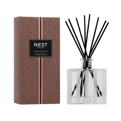 Nest New York Rose Noir & Oud Reed Diffuser 5.9 OZ with black reeds beside a rose-patterned box on Tampa Home & Garden Store