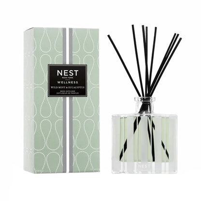 Nest New York Wild Mint & Eucalyptus Reed Diffuser 5.9 oz with black reeds beside mint box on Tampa Home & Garden Store