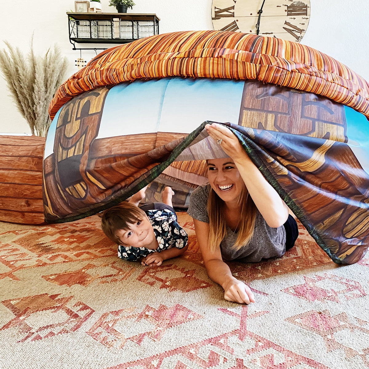 AirFort Tiki Hut Inflatable Play Fort by AirFort.com; child and mom under tiki hut indoors on Tampa Home & Garden Store