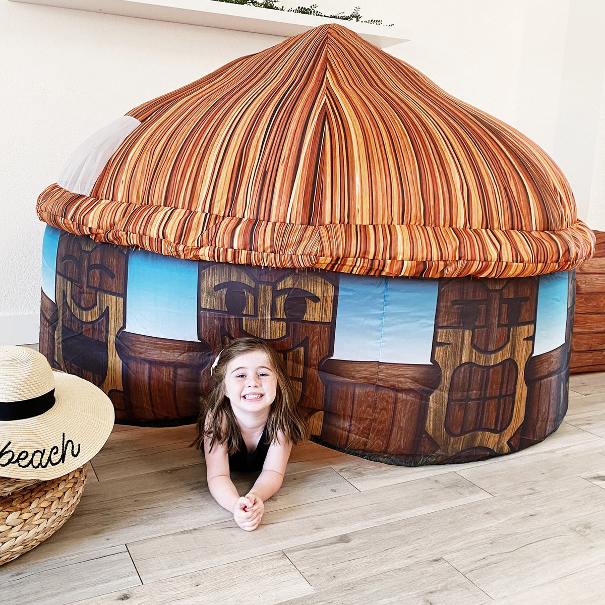 AirFort Tiki Hut inflatable kids play fort with thatched roof and blue tiki-wall panels on Tampa Home & Garden Store