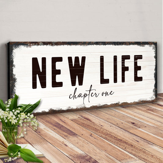 New Life Chapter One Sign canvas by Tailored Canvases with rustic frame and NEW LIFE on white on Tampa Home & Garden Store