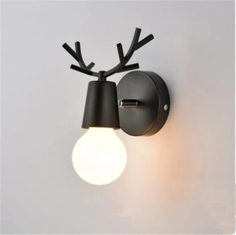Forest Haven antler wall sconce by Moktan Sabai, black metal wall light with globe bulb on Tampa Home & Garden Store