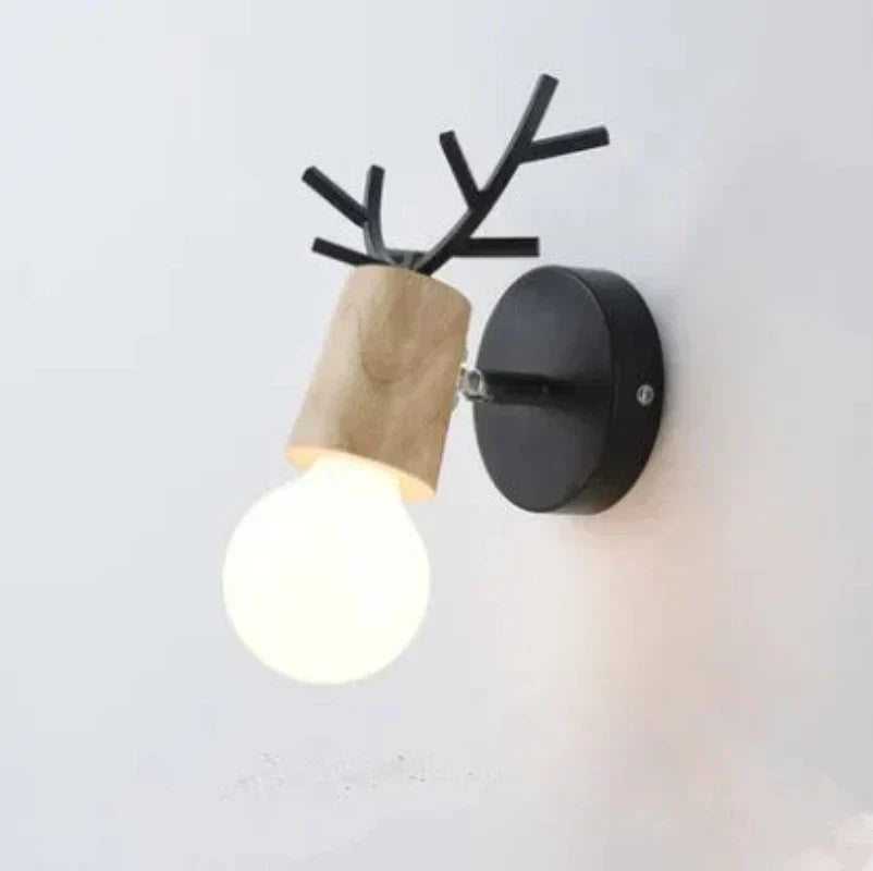 Forest Haven Antler Wall Sconce with black metal antler arms and wood sleeve backplate on Tampa Home & Garden Store