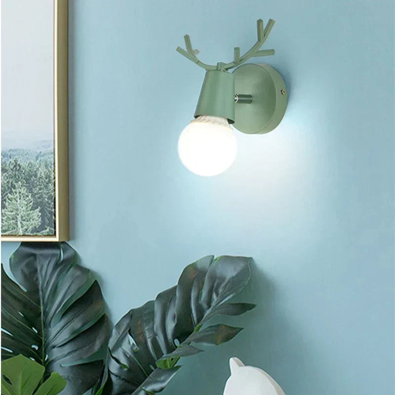 Forest Haven Antler Wall Sconce rustic green metal wall light with antlers Moktan Sabai on Tampa Home & Garden Store