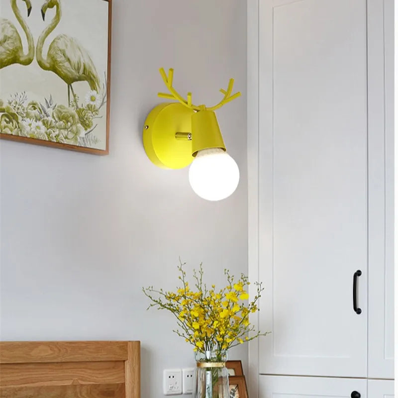 Forest Haven Antler Wall Sconce by Moktan Sabai: yellow wall light with antler accents on Tampa Home & Garden Store
