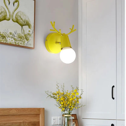 Forest Haven Antler Wall Sconce by Moktan Sabai: yellow wall light with antler accents on Tampa Home & Garden Store