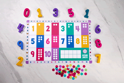 Counting chips by Domino & Juliette in assorted bright colors scattered on a colorful number board on Tampa Home & Garden Store