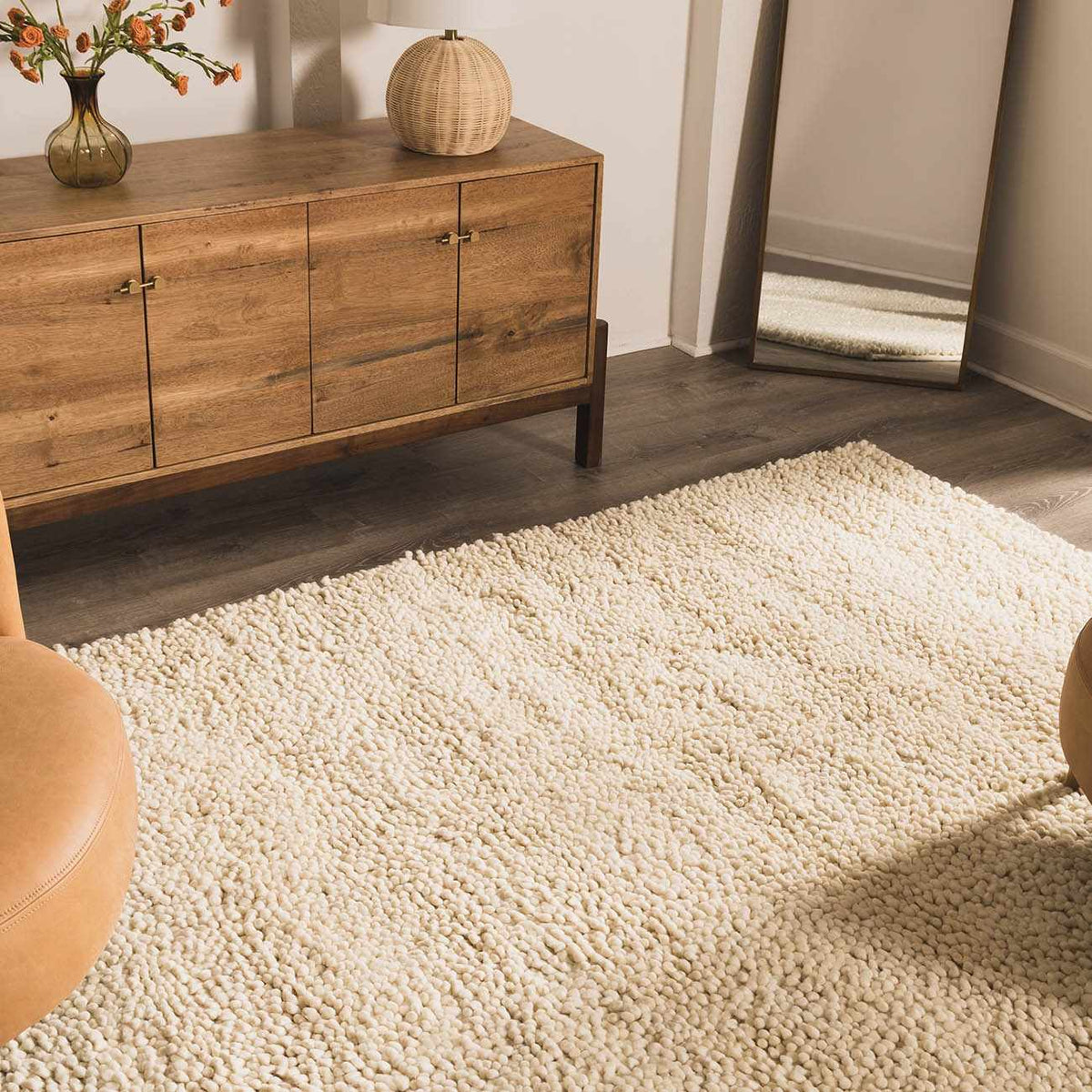 Oakridge Area Rug - Clearance cream shag rug by Boutique Rugs in a cozy living room on Tampa Home & Garden Store