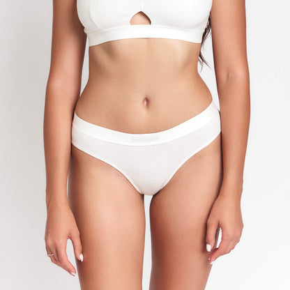 Mid-Rise Hemp Brief by Net Positive in white on model's torso on Tampa Home & Garden Store