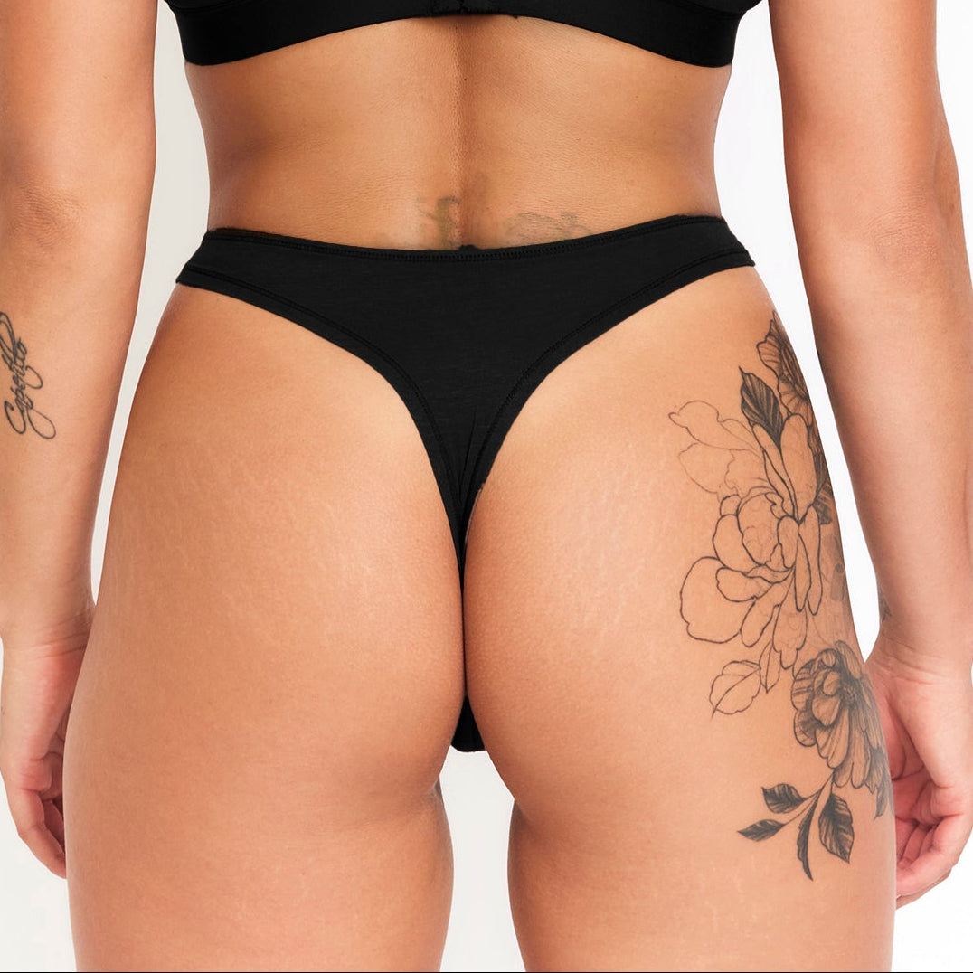 Net Positive hemp thong 7-pack black back view on tattooed model on Tampa Home & Garden Store