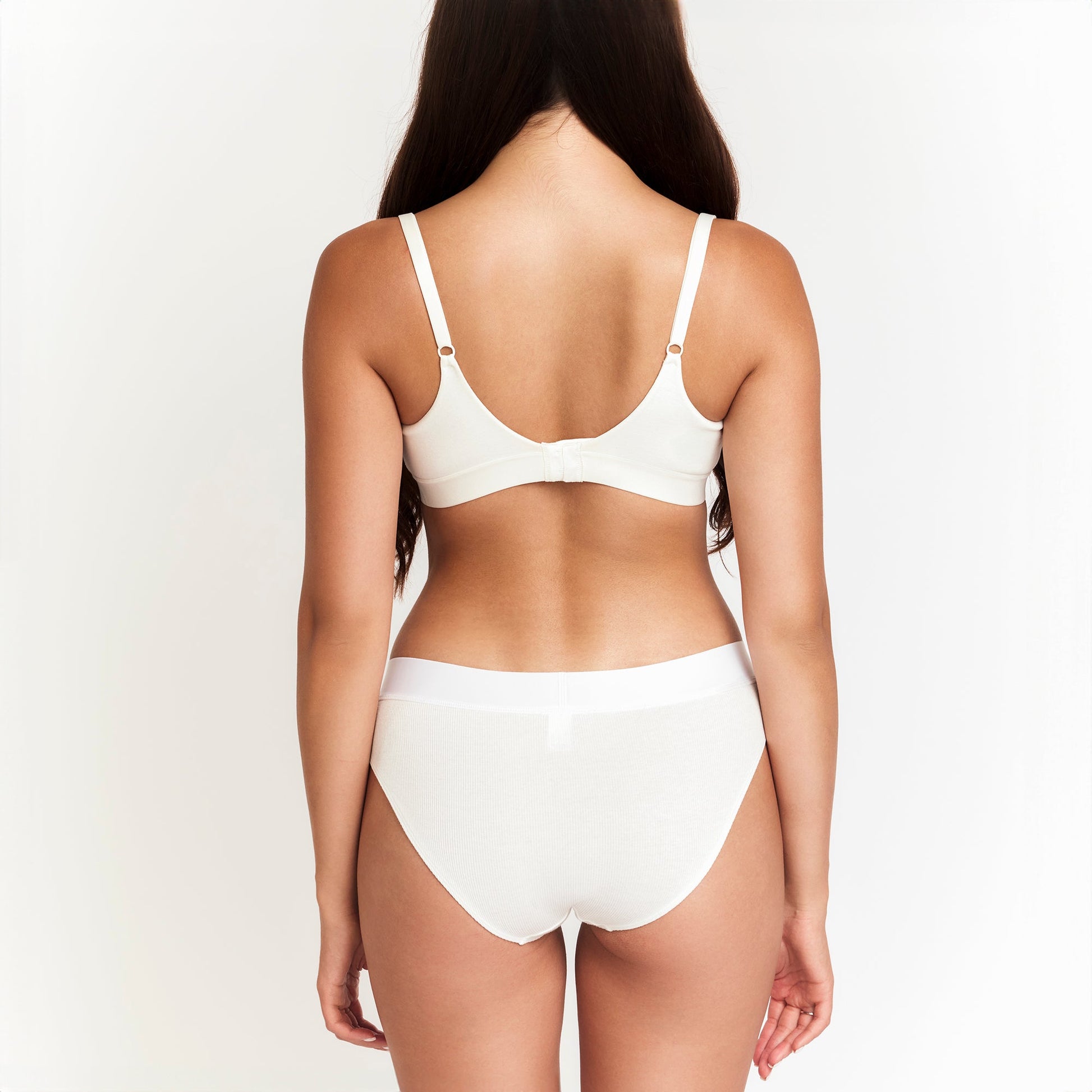 Botanical Dye Mid-Rise Brief organic rib white back view on model Net Positive on Tampa Home & Garden Store