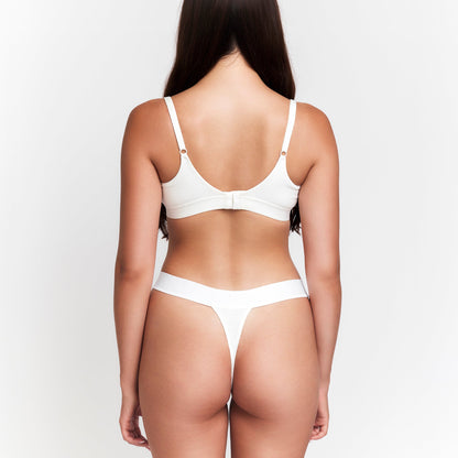 Botanical Dye Thong by Net Positive, organic rib white thong back view on model on Tampa Home & Garden Store