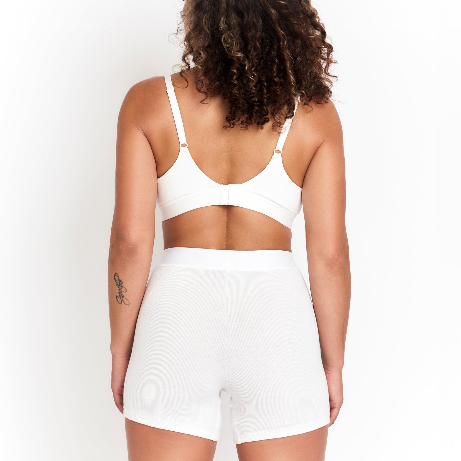 Botanical Dye Boxer white organic rib boyshorts worn by model, back view on Tampa Home & Garden Store