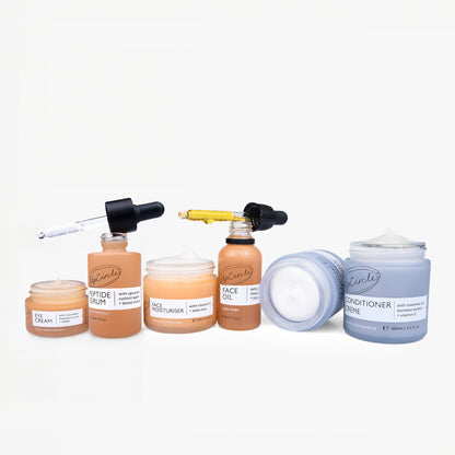 Best-Sellers Bundle skincare set by UpCircle with orange serum bottles and blue conditioner jar on Tampa Home & Garden Store