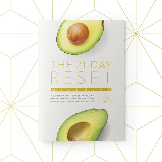 The 21 Day Reset meal plan booklet with avocado halves on a white cover, OWL Venice branding on Tampa Home & Garden Store