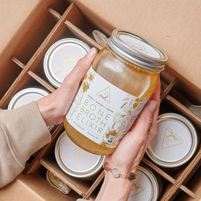 Organic chicken bone broth elixir from OWL Venice in glass jar, boxed with multiple jars in a cardboard shipping case on Tampa Home & Garden Store
