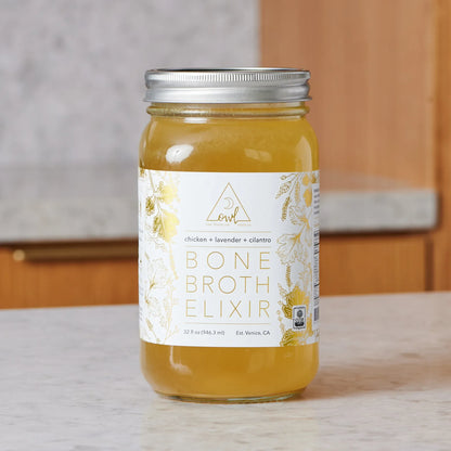 Organic Chicken Bone Broth Elixir glass bottle by OWL Venice with silver lid and gold label on Tampa Home & Garden Store