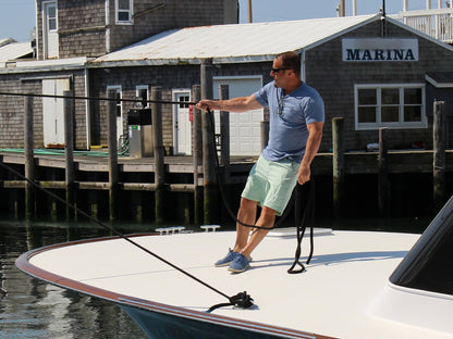 Oasis SS Tee by White Water Life, light blue short-sleeve tee worn by man at marina on Tampa Home & Garden Store