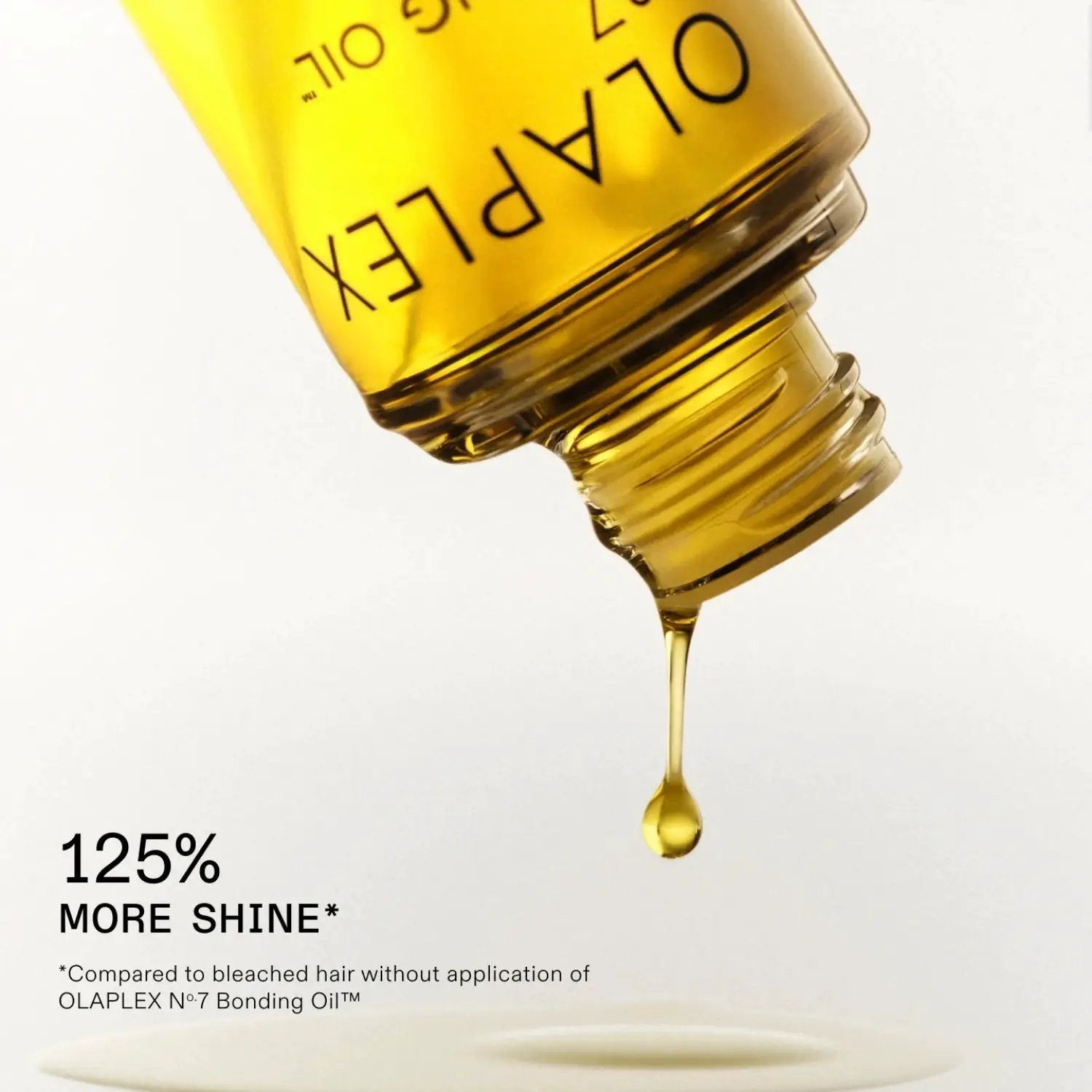 Olaplex No. 7 Bonding Oil bottle with golden-yellow liquid and OLAPLEX branding on Tampa Home & Garden Store