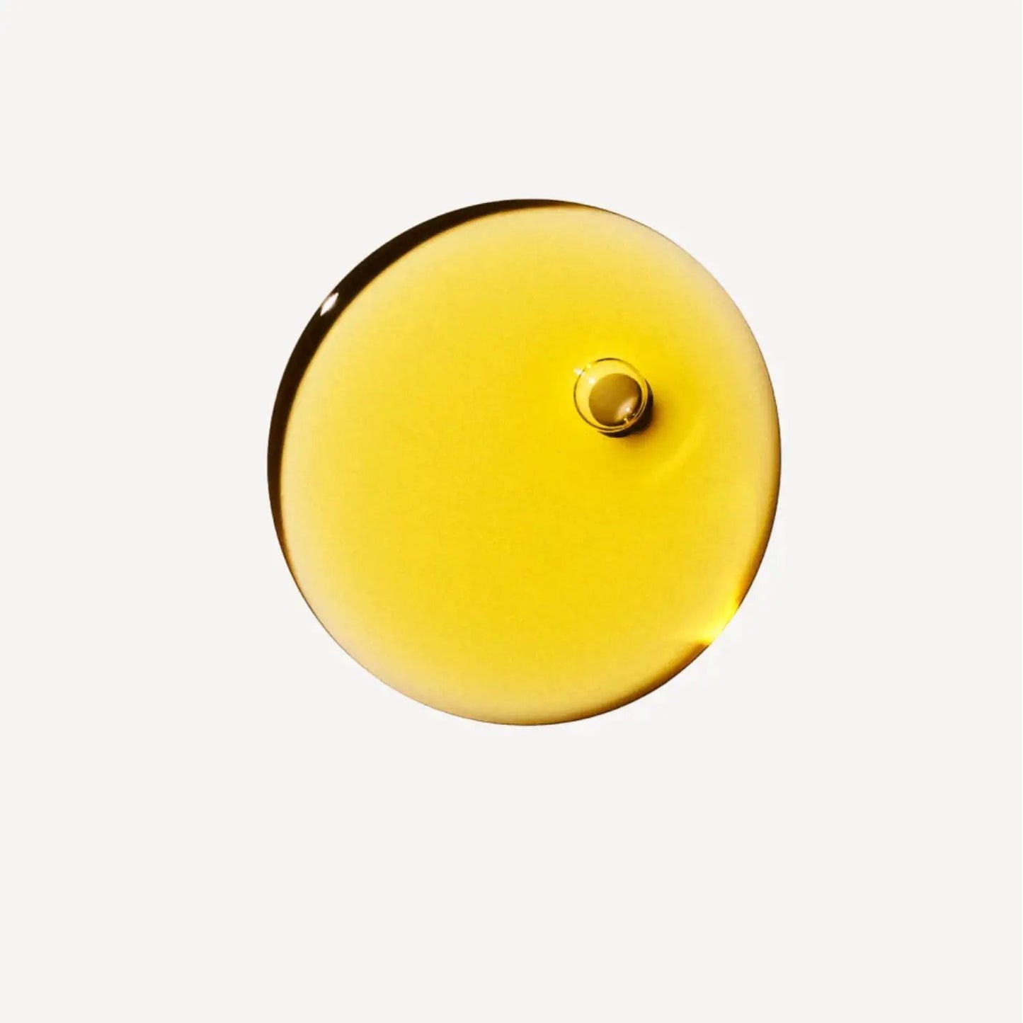 Olaplex No. 7 Bonding Oil by Nava Beauty, golden yellow hair oil drop on white background on Tampa Home & Garden Store